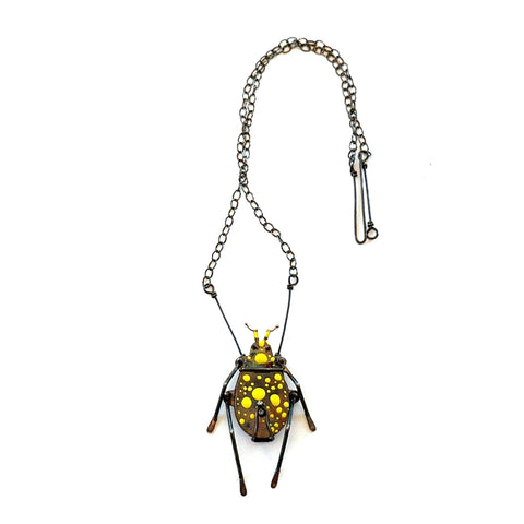 Yellow Dappled Beetle Necklace/Locket (with silver worm in locket)